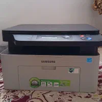 پرینتر لیزری سه کاره همراه با برگه اشانتیون