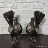 یک جفت پرنده آهنی نقره کوبی شده
