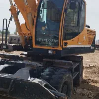 اجاره بیل مکانیکی لاستیکی بزرگ چکش وپاکت