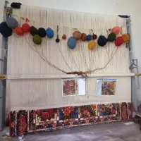 قالی نصفه بافته