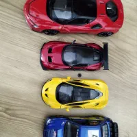 ماکت فراری از برند burago و سه عدد ماشین فلزی