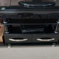 میز زیر تلویزیون شیشه ای