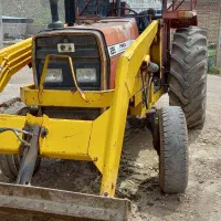 تراکتور فرگوسن ۲۸۵بیل دارو و تریلی چهار چرخ