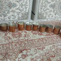 تعدادی ظروف مسی کاسه و لیوان نمک پاش