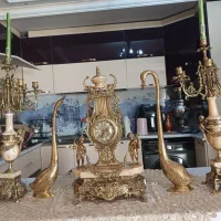 ساعت و شمعدانی و قو