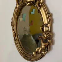 آینه و مجسمه فرشته