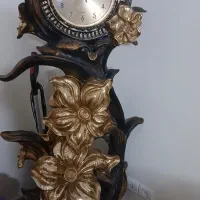 ساعت ایستاده ومجسمه تزئینی