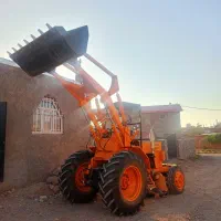 خدمات با مینی لودر تراکتور بیل عقب خاک ریزی