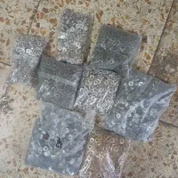 یک دستگاه موتور کرکره وچند بسته دکمه شلوار