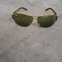 دو عدد عینک اصلی prada و ray.ban
