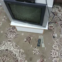 تلویزیون به همراه دستگاه دیجیتال