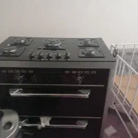 یک عدد اجاق گاز طرح فر نو صفحه شیشه ای