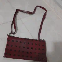 کیف زرشکی چرم اصل نونو