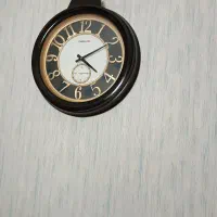 ساعت دیواری و تابلو فرش