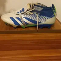 یک جفت کفش فوتبال استوک درشت|کیف، کفش، کمربند|بابل, |دیوار