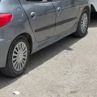 رینگ و لاستیک۱۴مخصوص ۲۰۶و...با قالپاق اسپرت