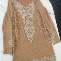 تعدادی تاپ و شلوار و بلوز و تونیک