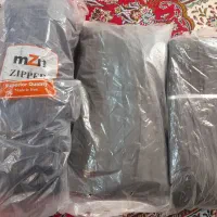 تعدادی نخ و زیپ خیاطی