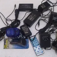 ویدیو سی دی و تعدادی اداپتور و باطری و کابل