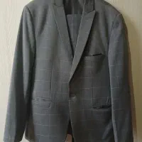 یک دست کت شلوار نو