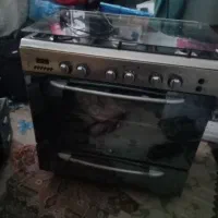 اجاق گاز فر دار و گرمکن غذا