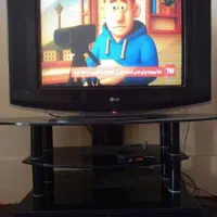 تلویزیون 29 اینچ و میز شیشهای