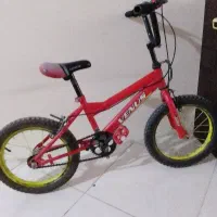 دوچرخه سایز ۱۶در حد نو....لاستیک‌ها و رکاب نو