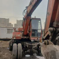 اجاره بیل مکانیکی چرخ لاستیکی اطلس ۳۰۲