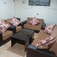 مبل هفت نفره به همراه کوسن و میز جلو مبلی