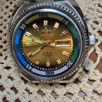 ساعت اورینت طلایی