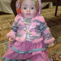 عروسک با لباس زمستانی