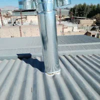 نصب وکاربیت لوله بخاری وشومینه سقف شیروانی