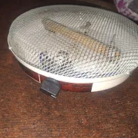 بخاری برقی.کرسی.گوشی تلفن