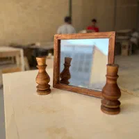 اینه و شمعدان چوبی