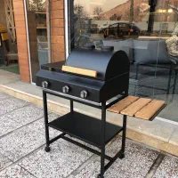 باربیکیو کنار شعله بغل پلوپز دار اجاق گاز کباب پز