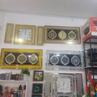 ساعت دیواری گوشواره دار و تابلو