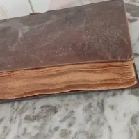 کتاب قرآن مجیدخیلی قدیمی جلد چرب