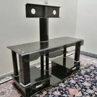 میز تلویزیون شیشه ای تمیز