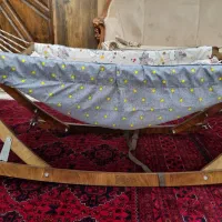 گهواره کودک همراه با ساک نگهداری
