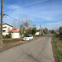 زمین-مسکونی-بر-جاده-اصلی-دور-دیوار-خشکبیجار