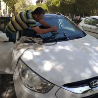 ترمیم سنگخوردگی و ترک شیشه خودرو بااشعهUVخدمات در