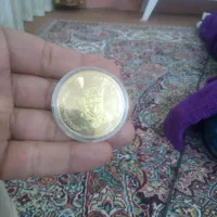 سکه طرح یادبود شاه وشهبانو فرح