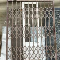 درب آکاردئونی بزرگ درانباری ودریچه۷۵در۷۵