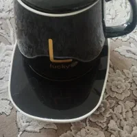 یک عدد ماگ با زیر پایه حرارتی