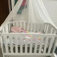 گهواره کنار مادر