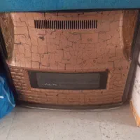 یک عدد بخاری گازی بزرگ ۱۴۰۰۰ و یک بخاری طرح شومینه
