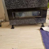 بخاری سبزی خورد کن و تعدادی لوازم خانه،کالسکه