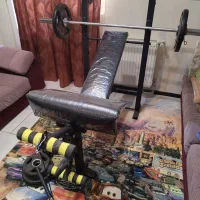 میز پرس ۱۰ کاره به همراه وزنه دمبل و هالتر