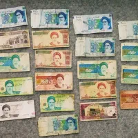 تعدادی سکه و پول کاغذی قدیمی