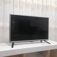 تلوزیون ال جی ۳۲ اینچ همراه میز تلوزیون